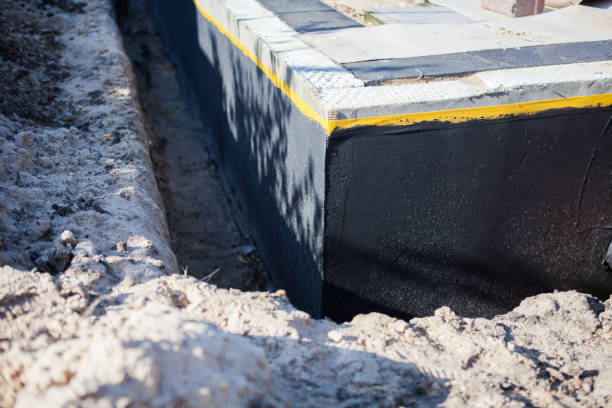 Professional Waterproofing technician working in Eland, WI